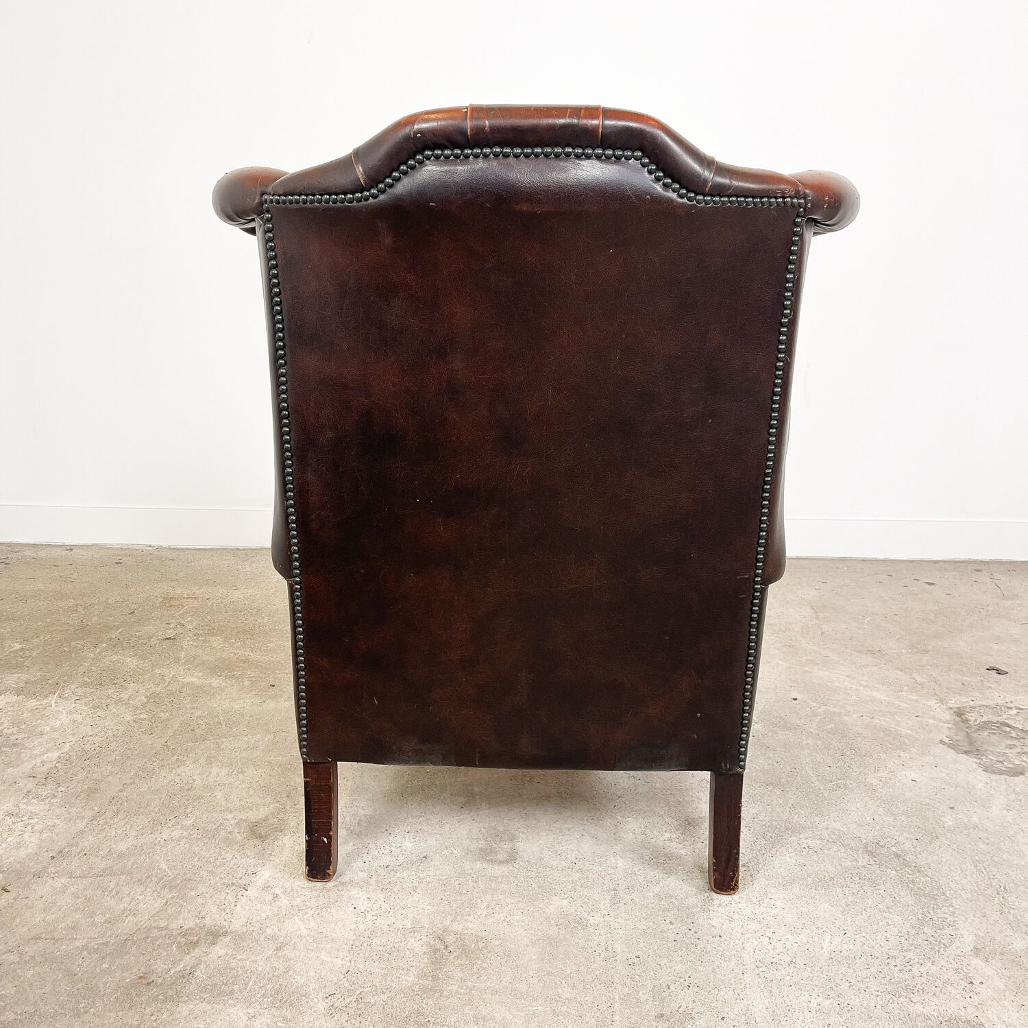 Vintage rustic dark brown leather chesterfield wingback armchair wassenaar