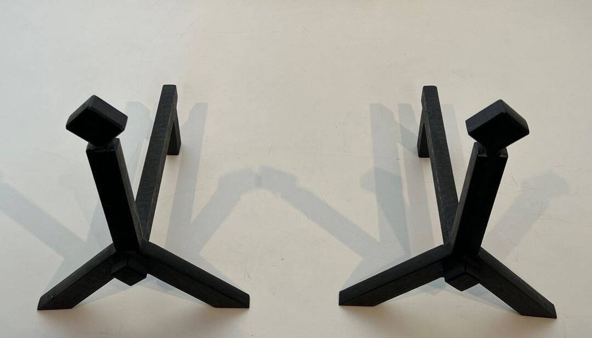 Pair of Modernist Black Iron Andirons with Diamond Finials and Angled Bases