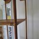 Storage column, wooden bookshelf and woven rattan.
