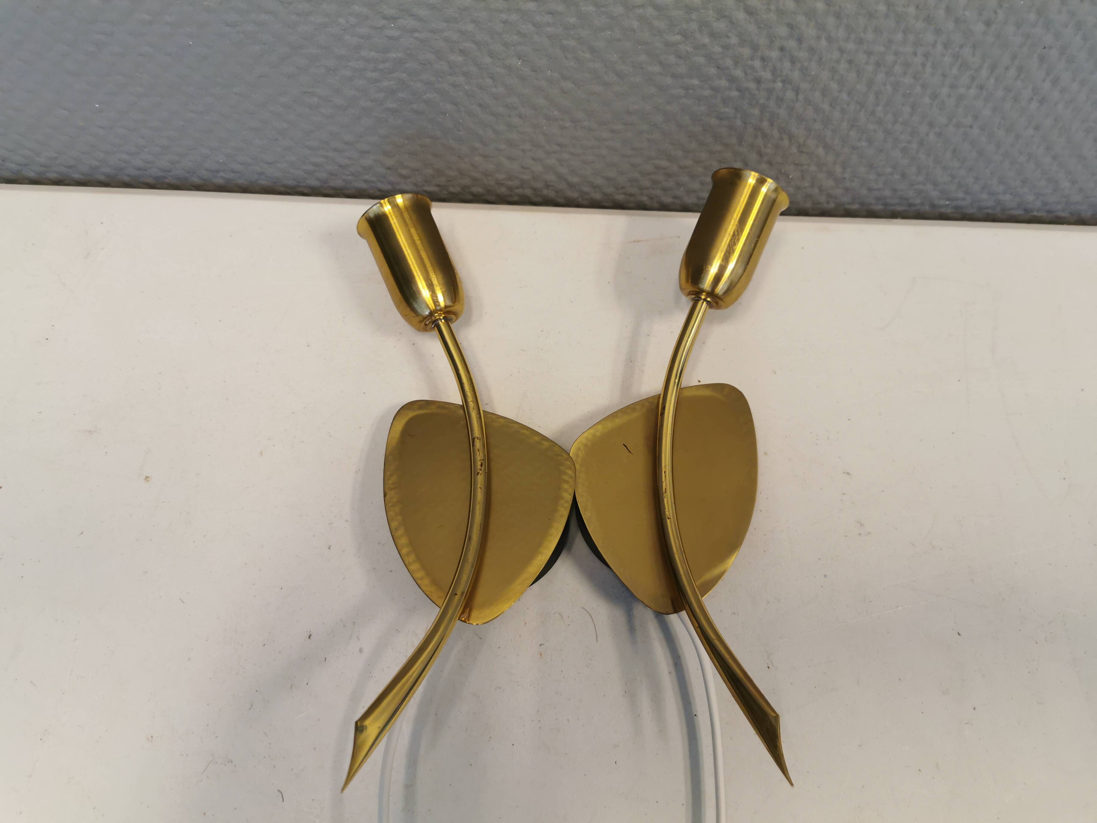 A set of "tulip" wall lamps in golden colored metal. Danish 1970-80s