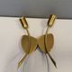 A set of "tulip" wall lamps in golden colored metal. Danish 1970-80s