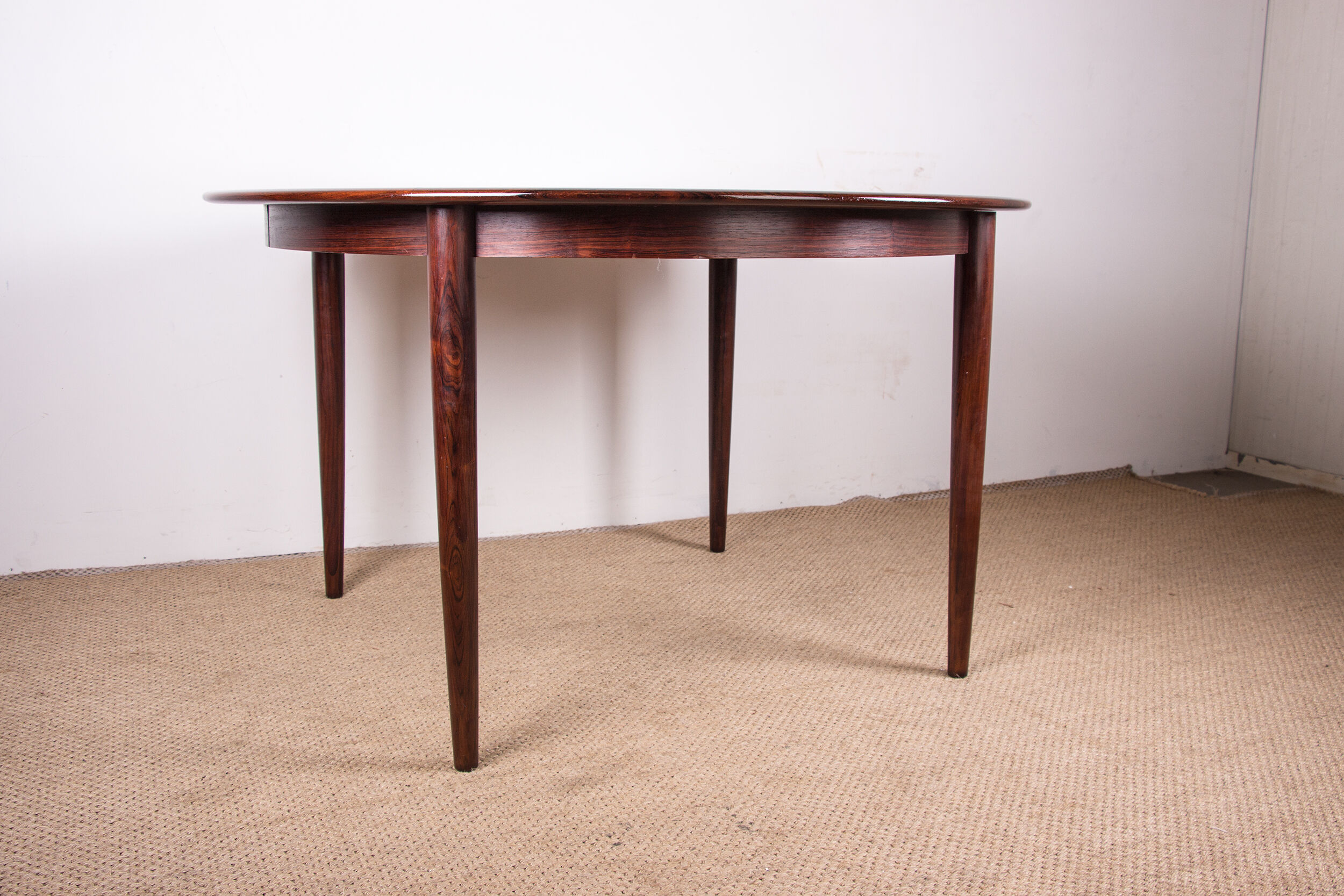 Danish extendable dining table in Rio Rosewood model 55 by Arne Vodder for Sibast 1958.