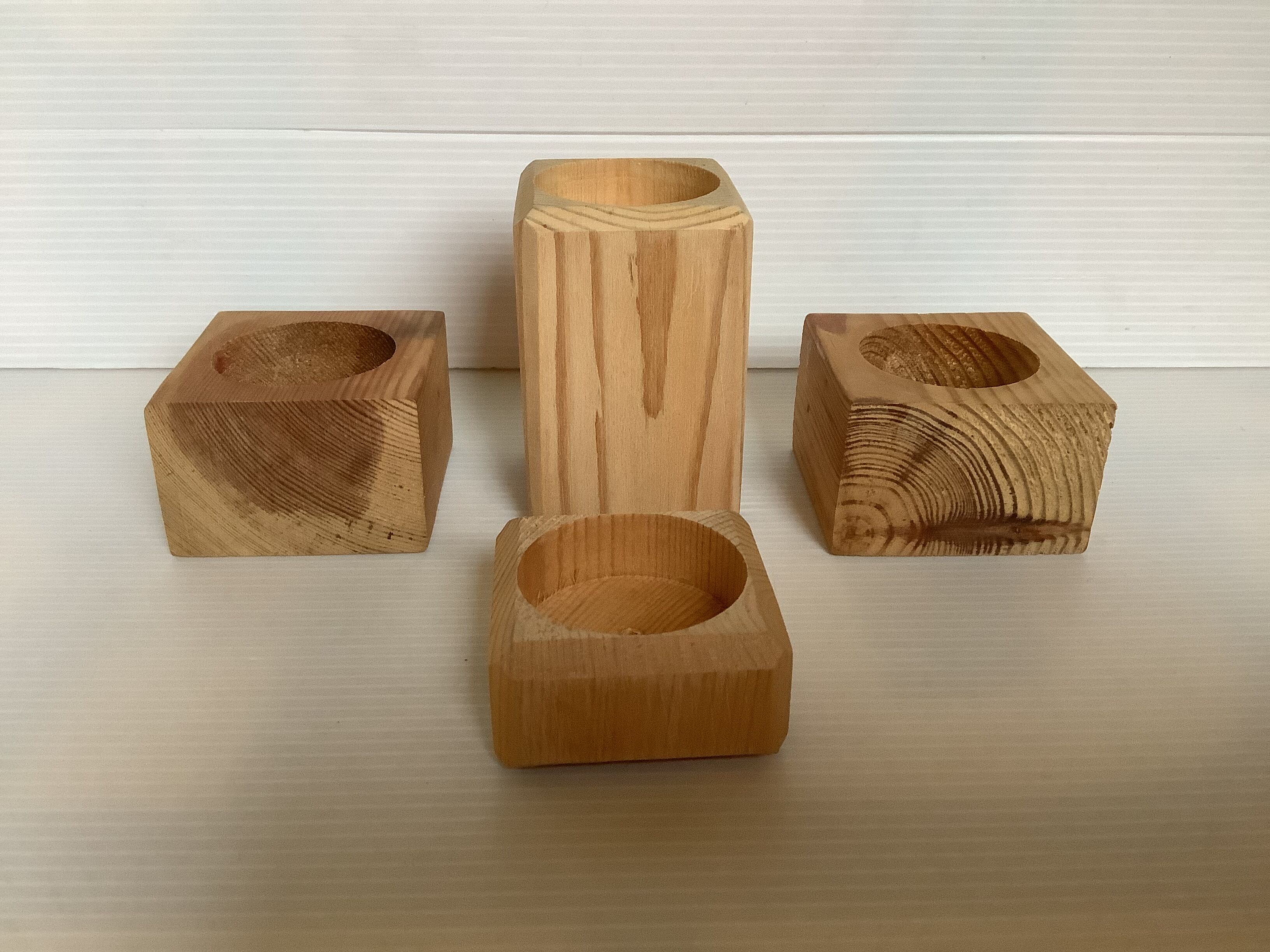 Set of four scandinavian wooden candle holders