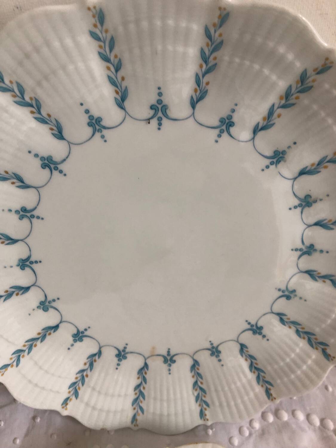 Set of 4 antique Giraud Sauviat porcelain plates.