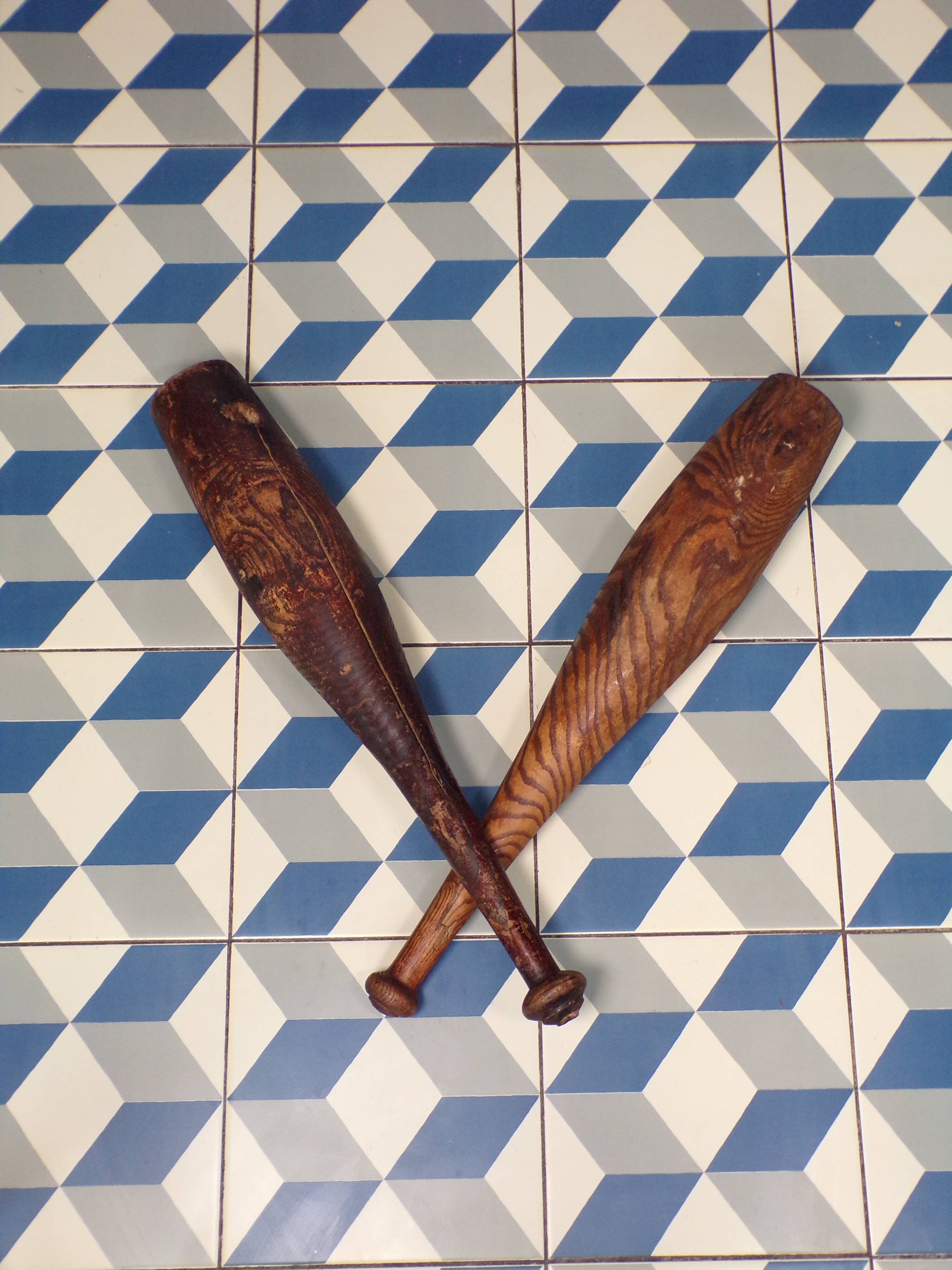 2 old wooden juggling clubs