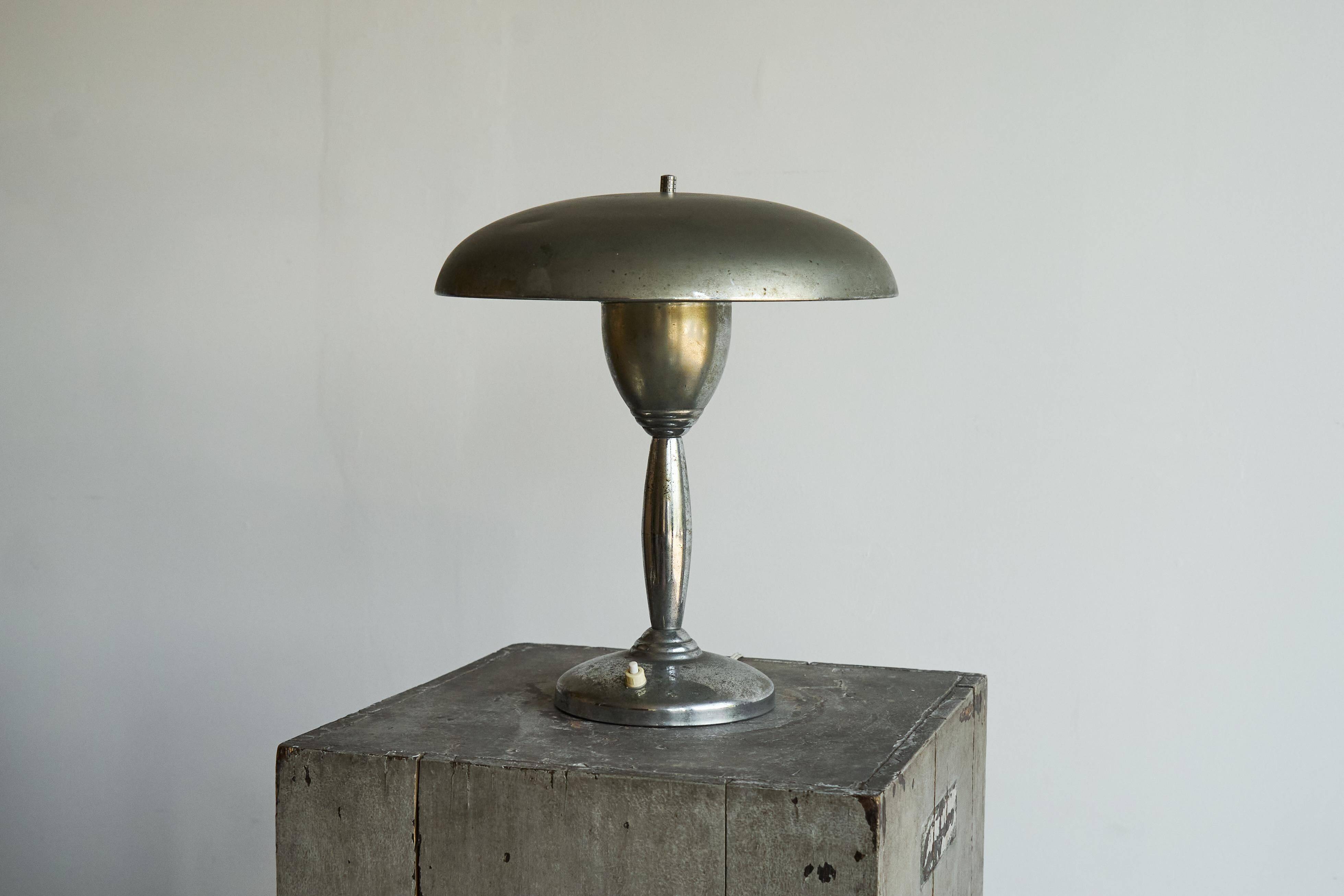 Patinated brass and chrome table lamp from the 1950s.