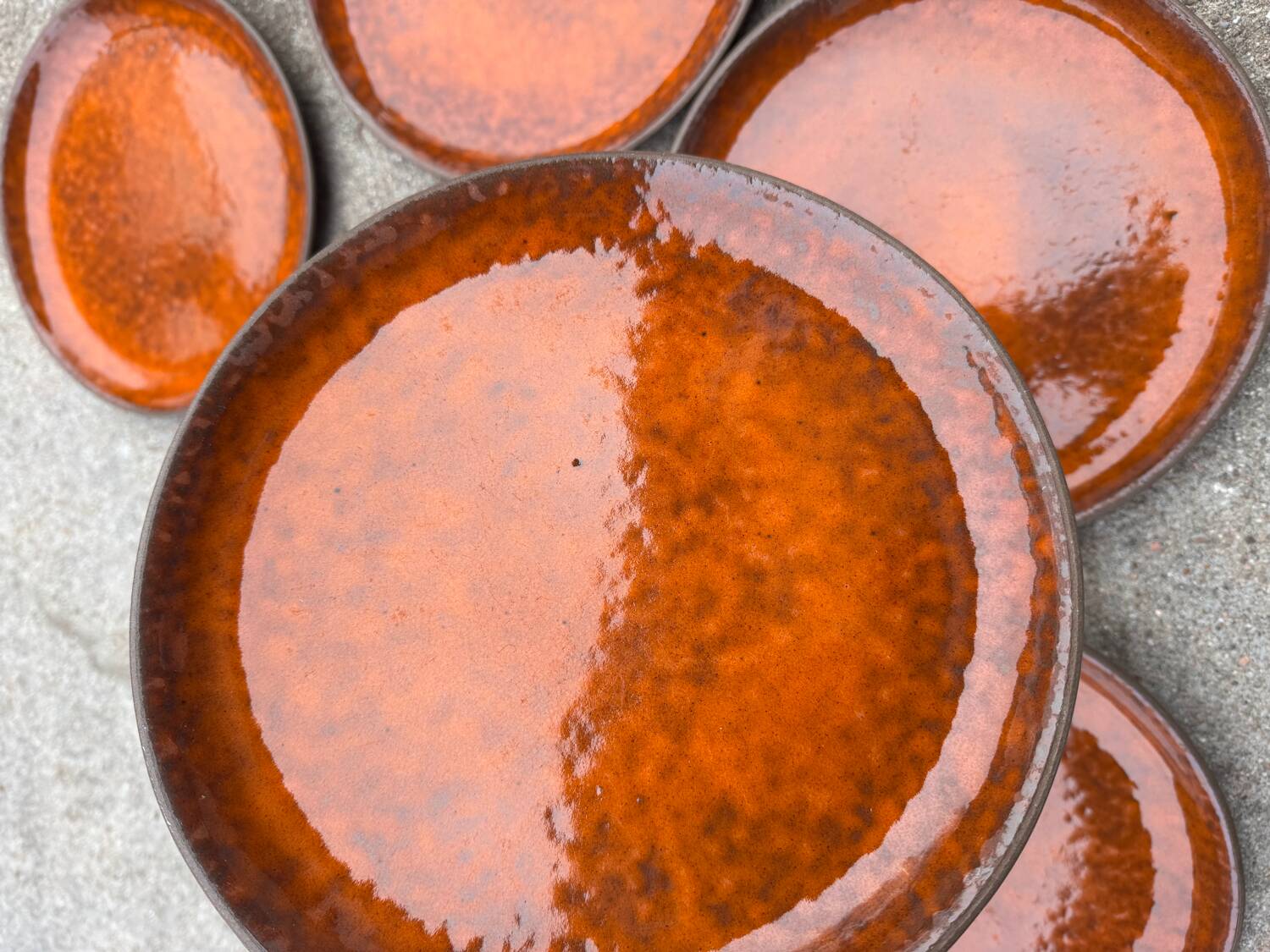 Orange glazed ceramic plates from the 1970s