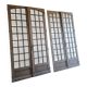 Two pairs of solid oak doors with small panes.