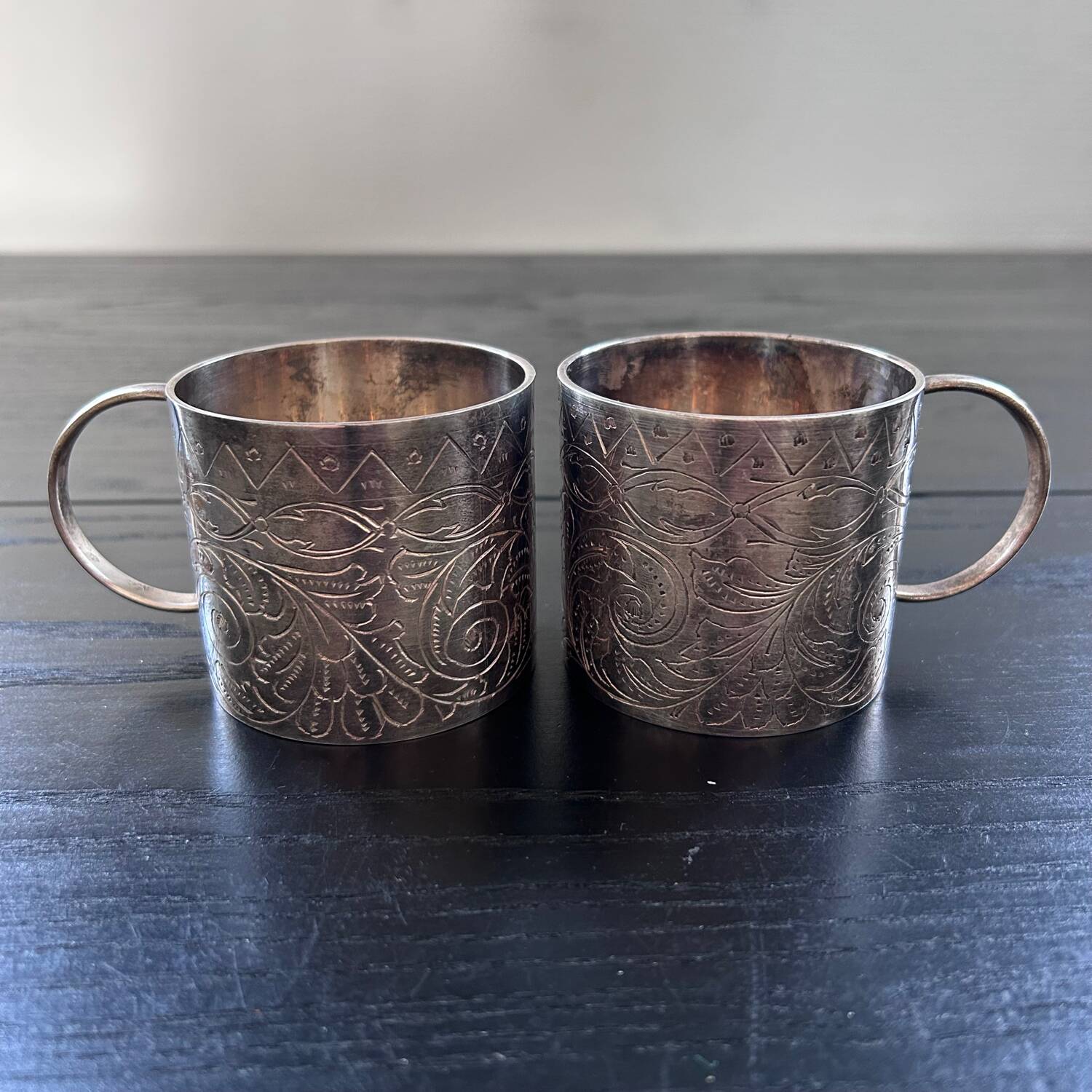 Pair of chiseled silver cups
