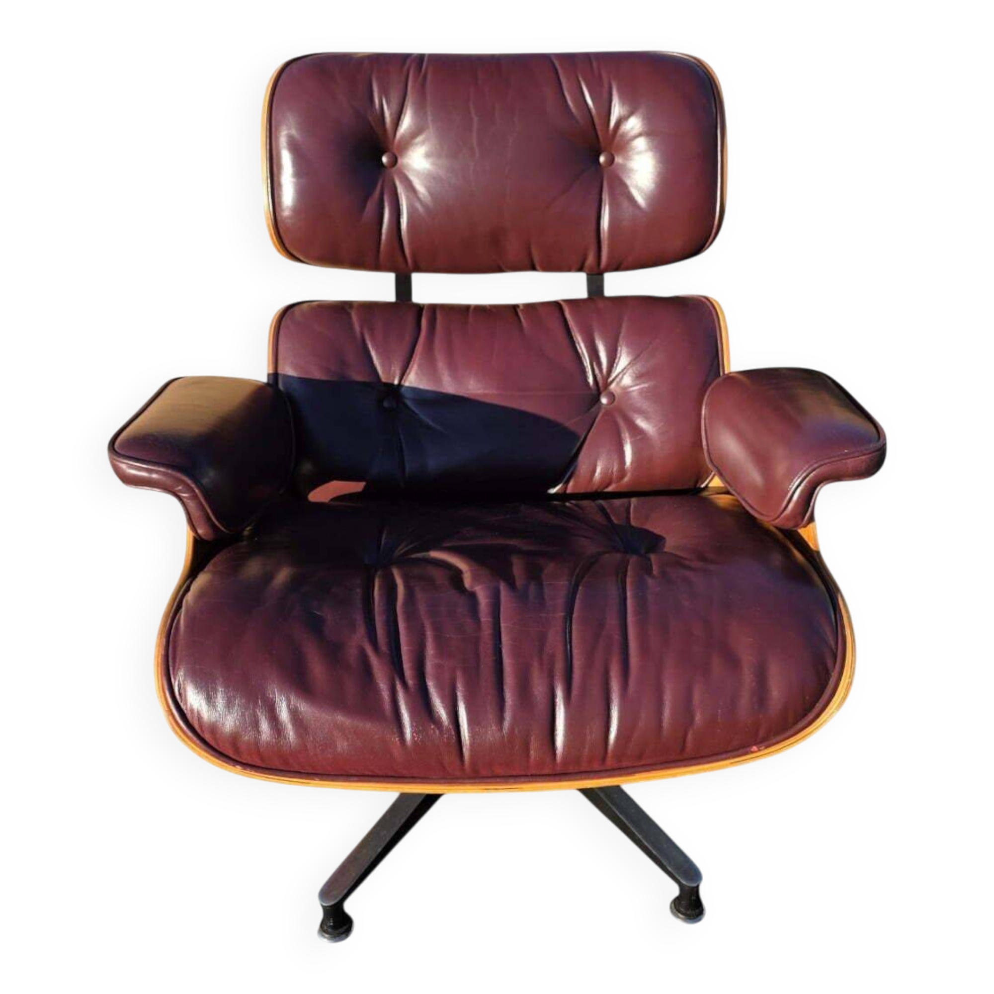 Original Eames lounge chair by Herman Miller in burgundy rosewood.
