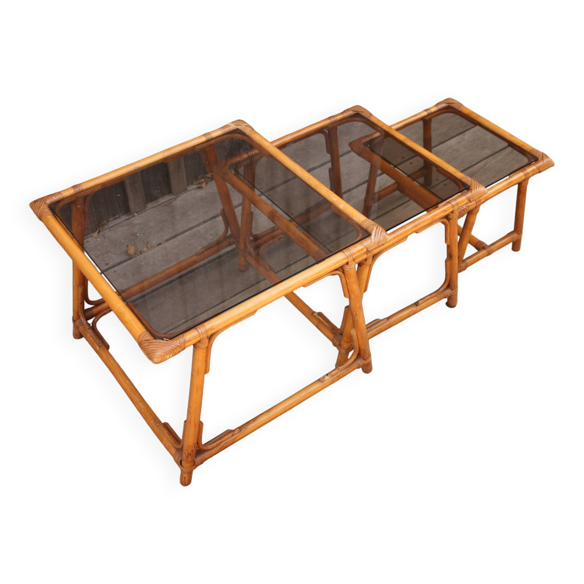 Nesting tables in rattan and glass