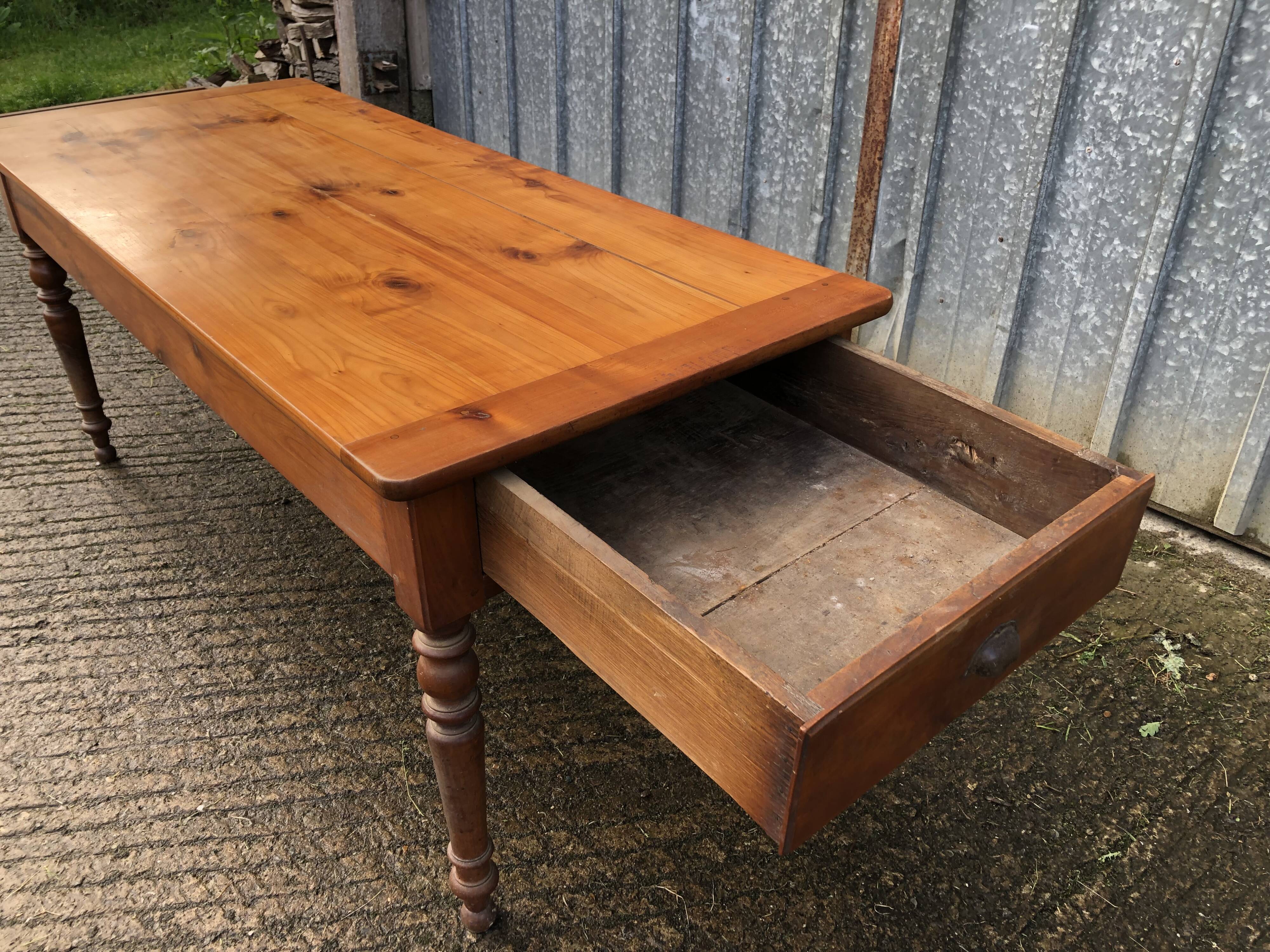 Antique farmhouse table in solid cherry wood in Louis Philippe style.