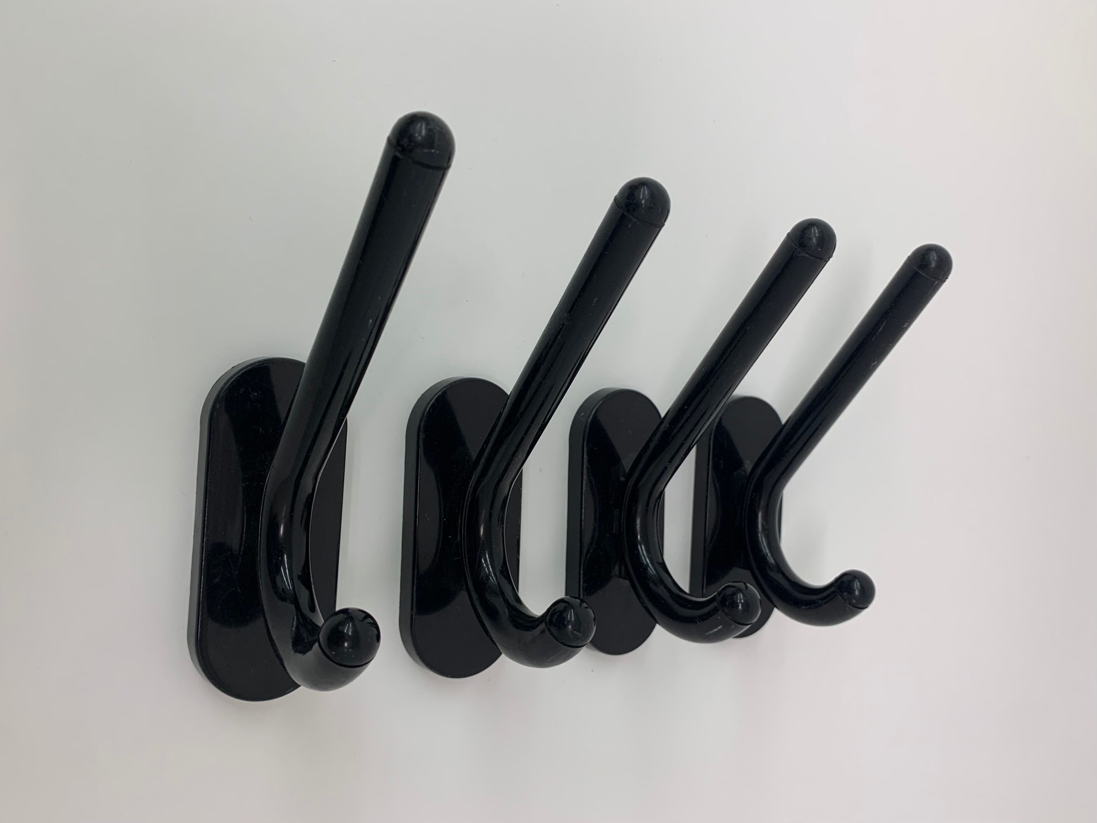 Set of 4 con & con Italian black wall coat / towel hangers , 1970’s