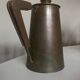 Modernist Italian pitcher design from the 1960s in patinated wood and metal.