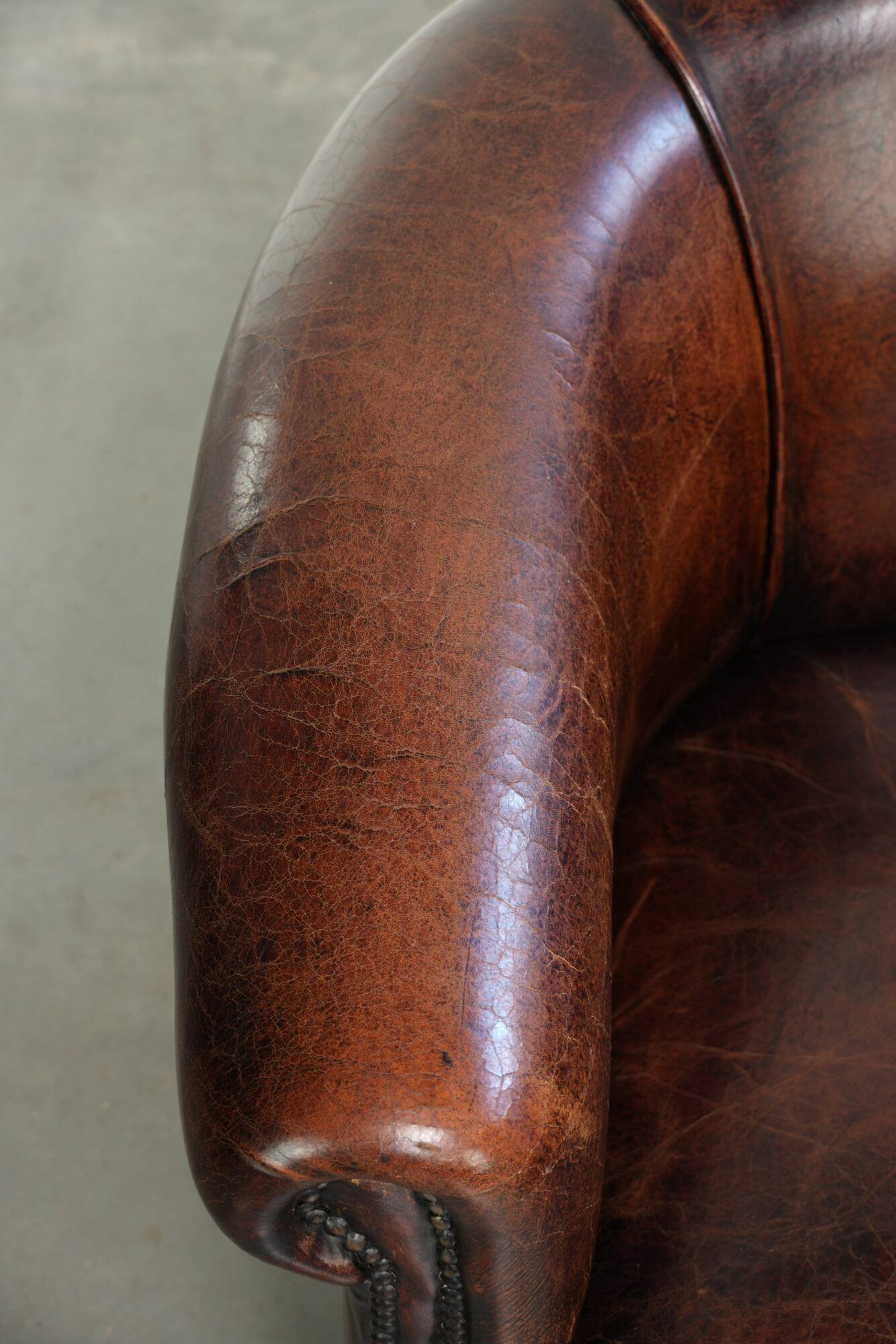 Vintage sheepskin club armchair with beautiful colours and a subtle size