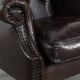 Dark brown cowhide Chesterfield wingback armchair in classic English style