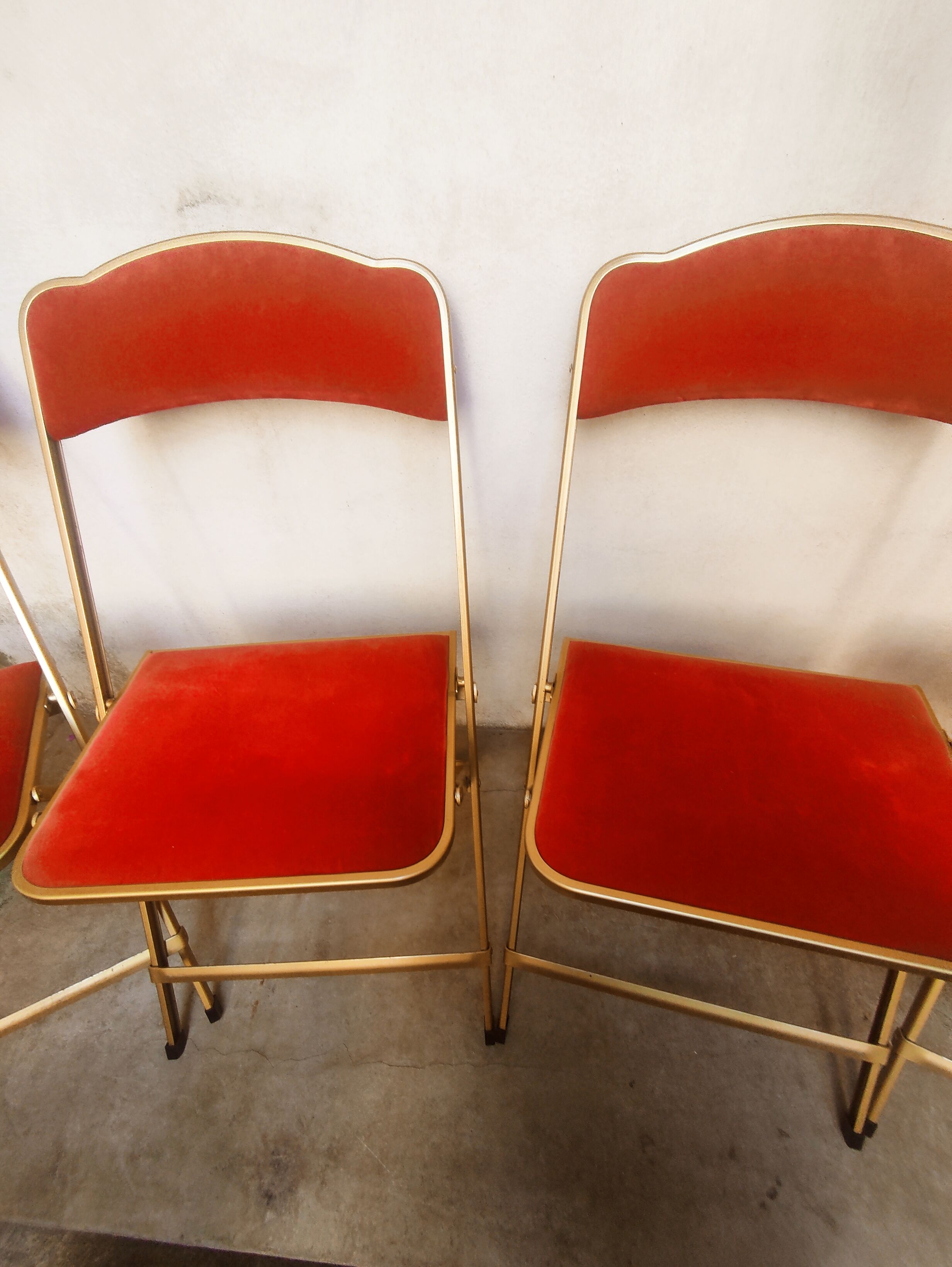 4 golden foldable chairs in scarlet velvet