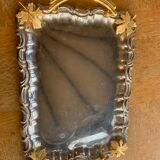 Silver metal top and decoration of foliage and handles in vintage brass