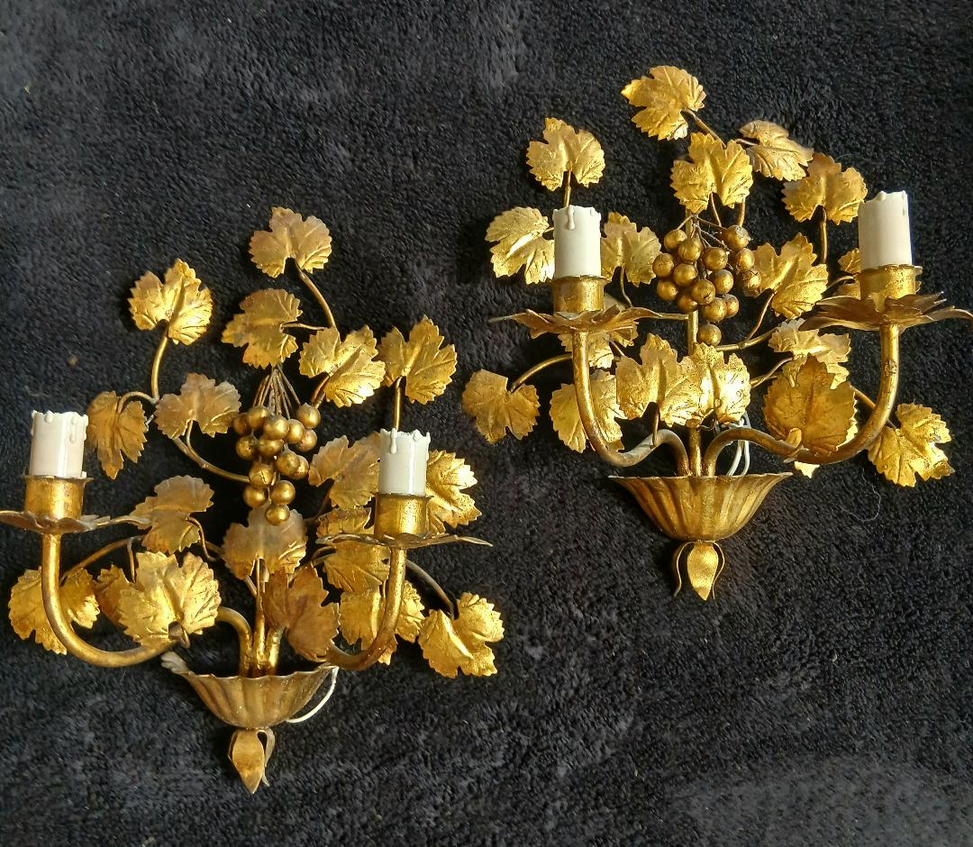 Stunning vintage wall lights in gilded iron with vine and grape decor from Italy.