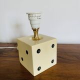 Lamp base representing a die