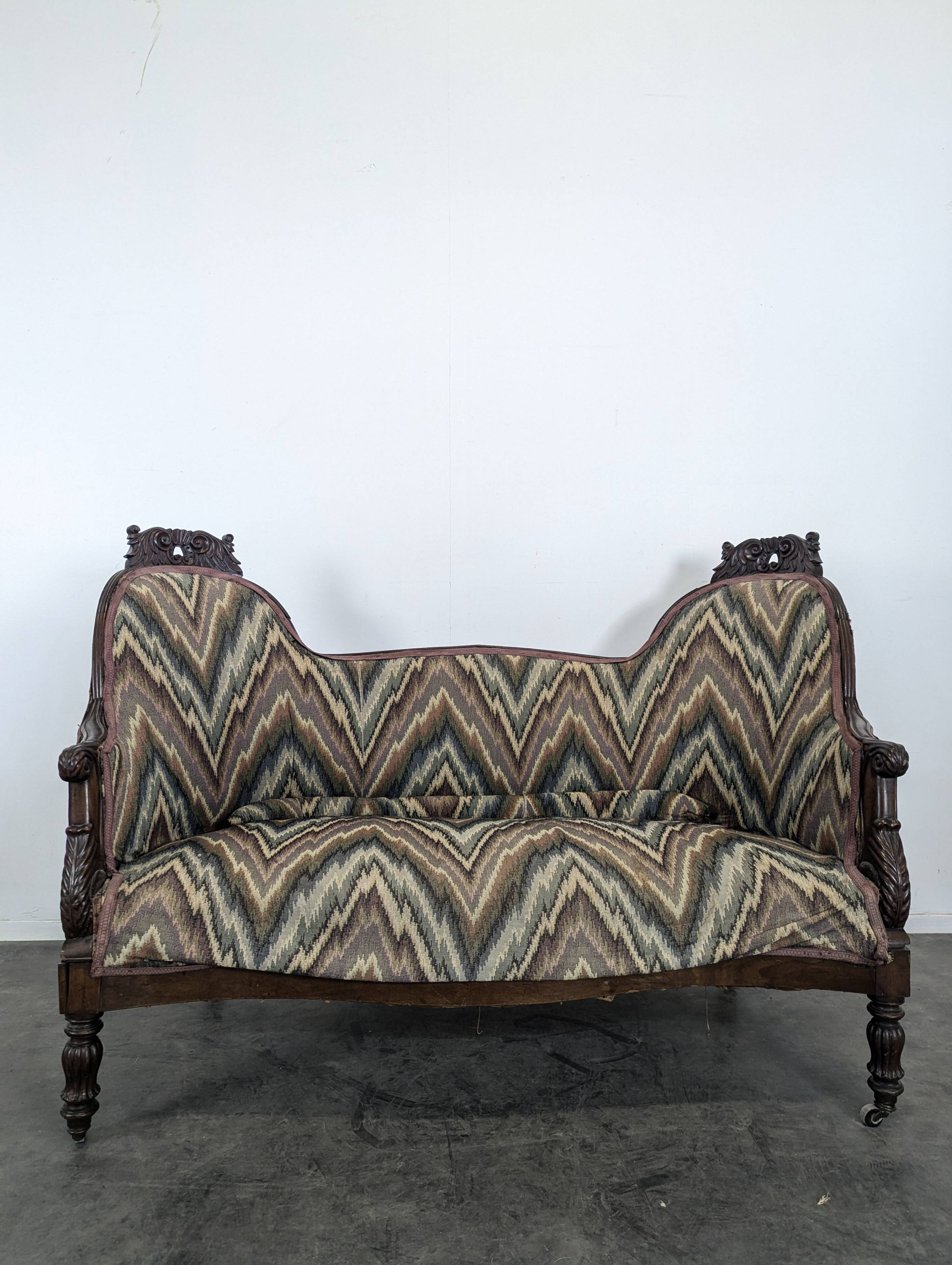 Mahogany banquette sofa in Louis Philippe style.