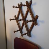 1900 accordion coat holder