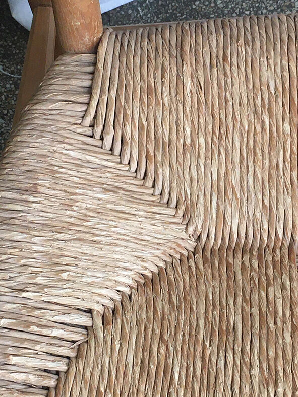 "Paillé" armchair by Charlotte Perriand