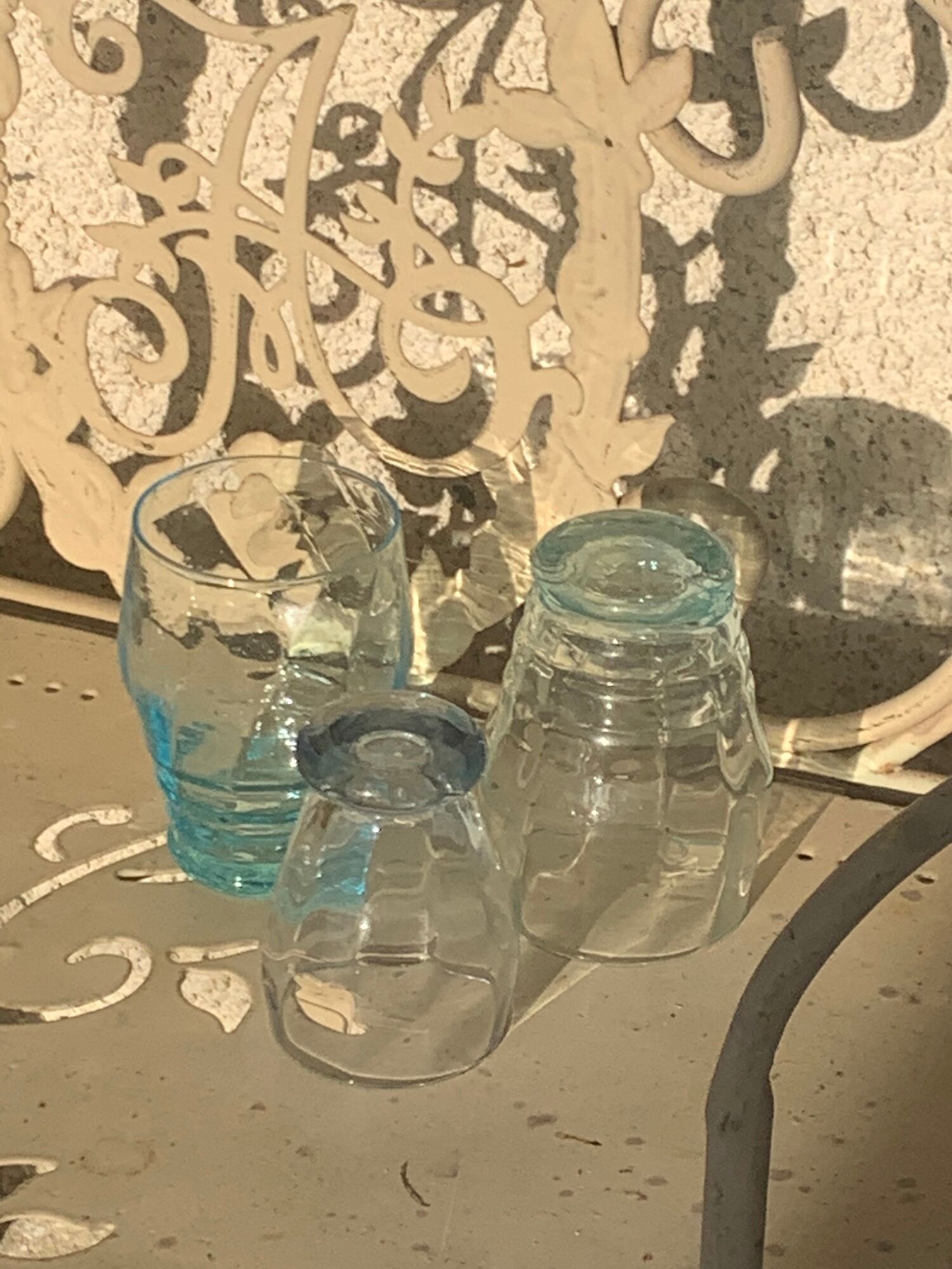 Liquor service consisting of a blue glass decanter and. 3 small antique glasses