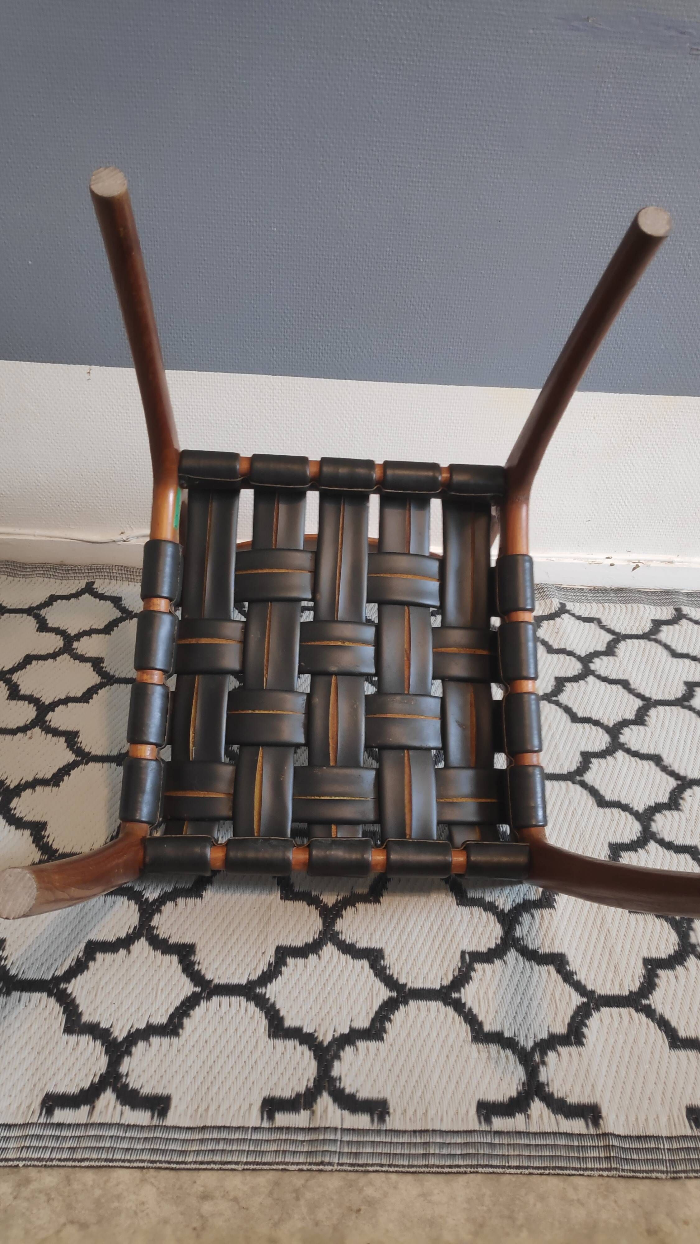 chair wooden structure and sitting with braiding of black skai strips