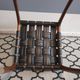 chair wooden structure and sitting with braiding of black skai strips