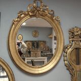 Miroir ovale en bois doré 93x73cm