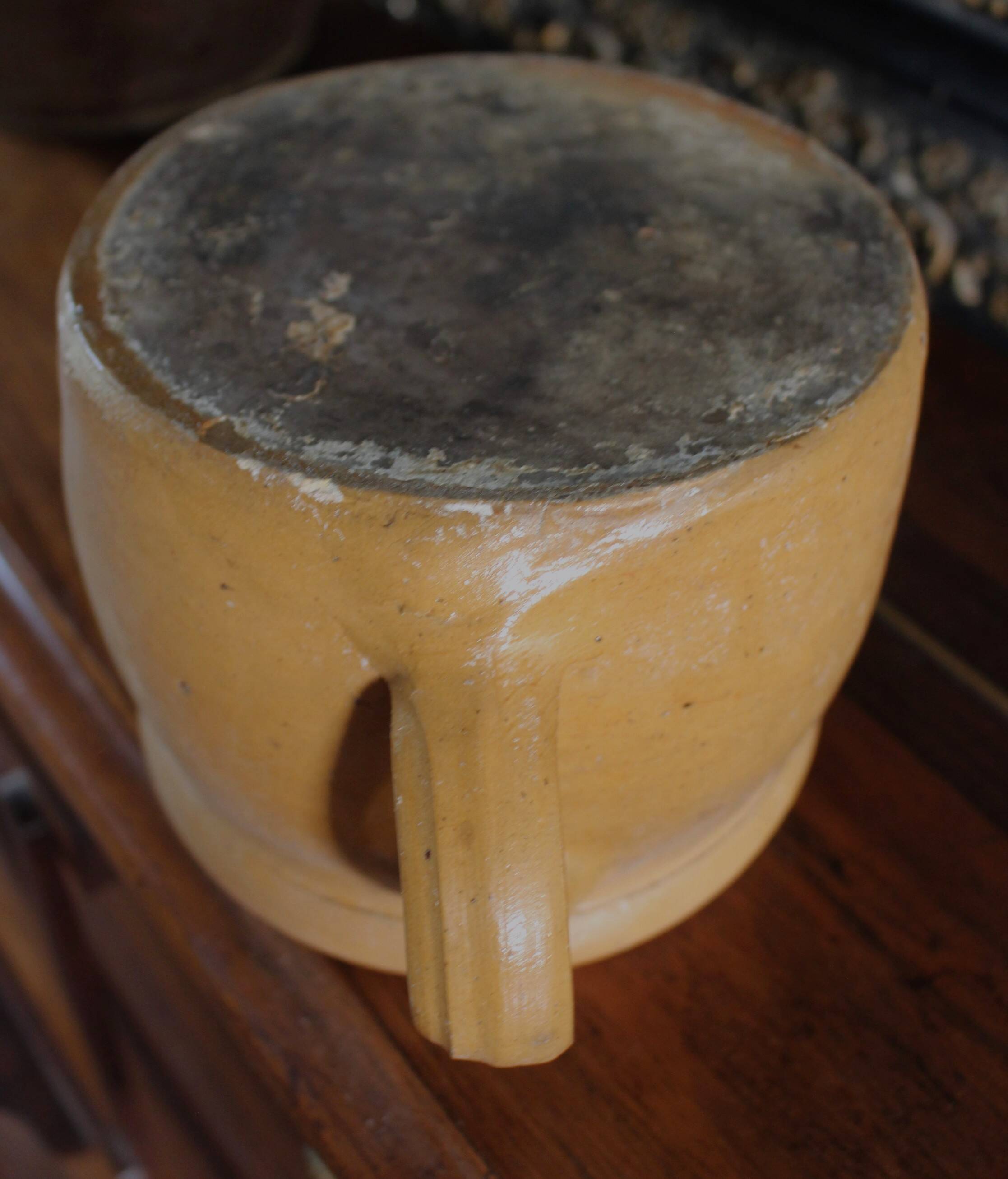 Round terracotta milk jug with handle