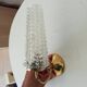 Vintage wall light in brass and etched glass.