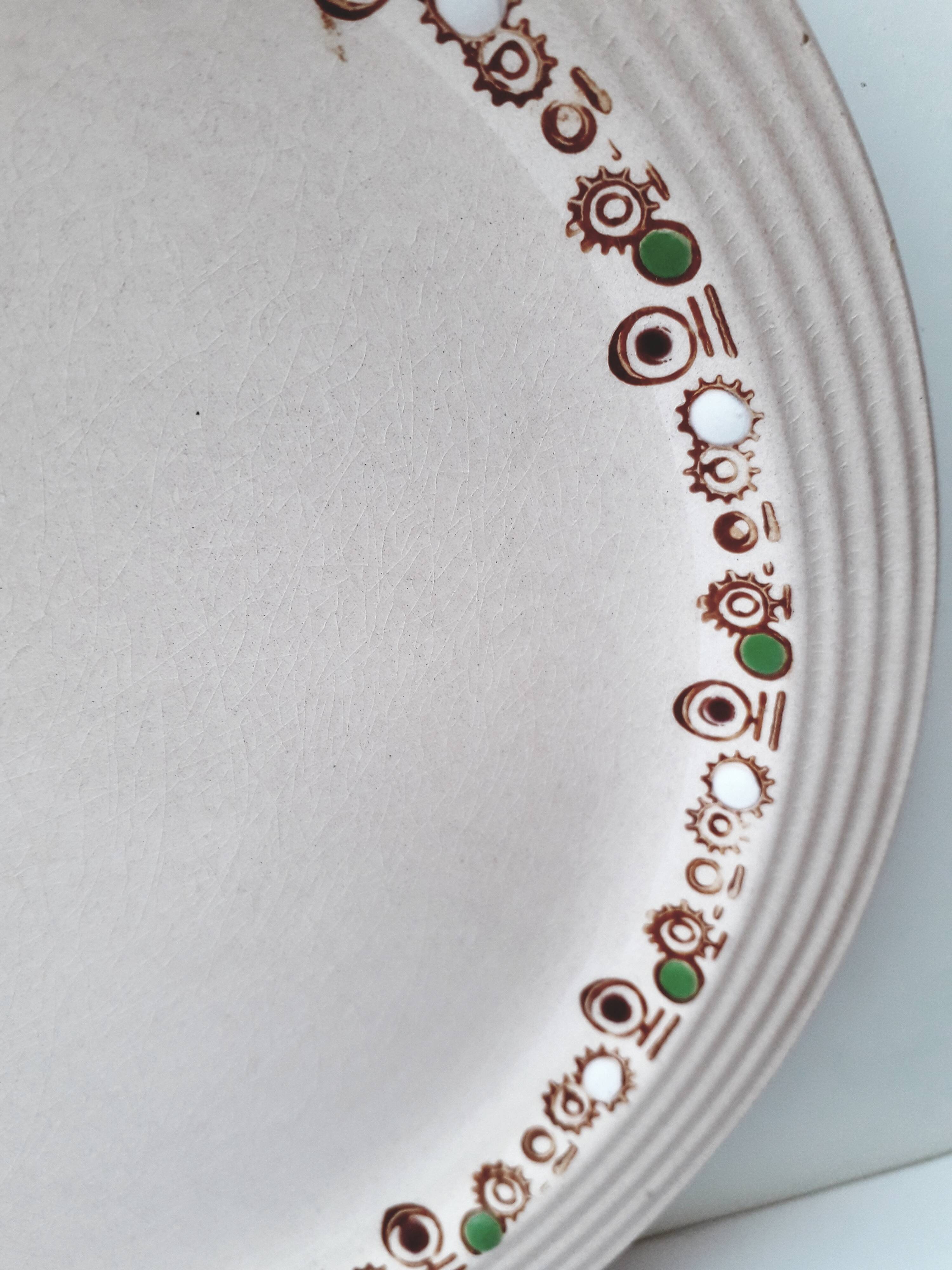 Set of 7 Betty Longwy model plates with floral decoration