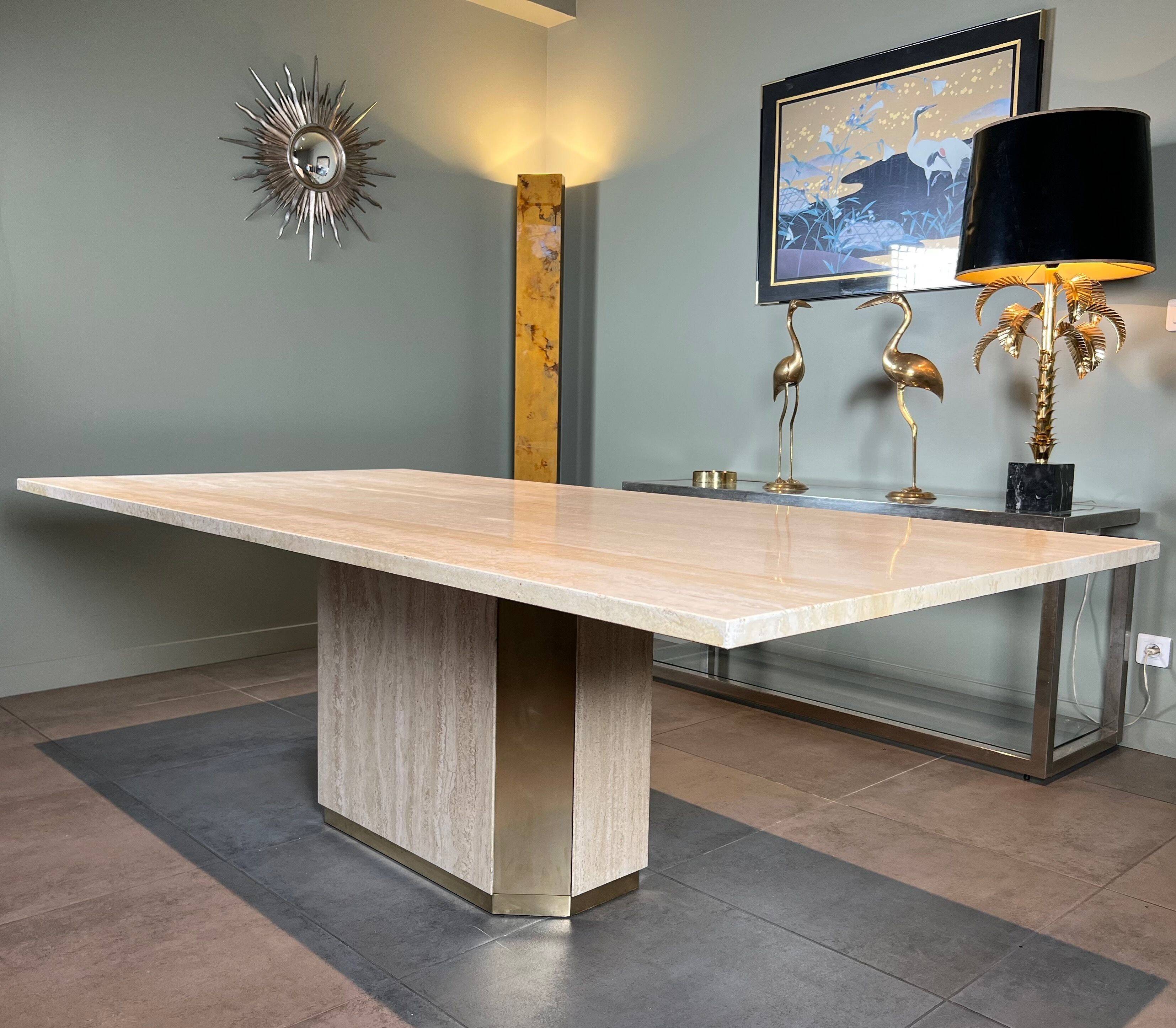Dining table in travertine and brass. French work. Around 1970.