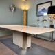 Dining table in travertine and brass. French work. Around 1970.