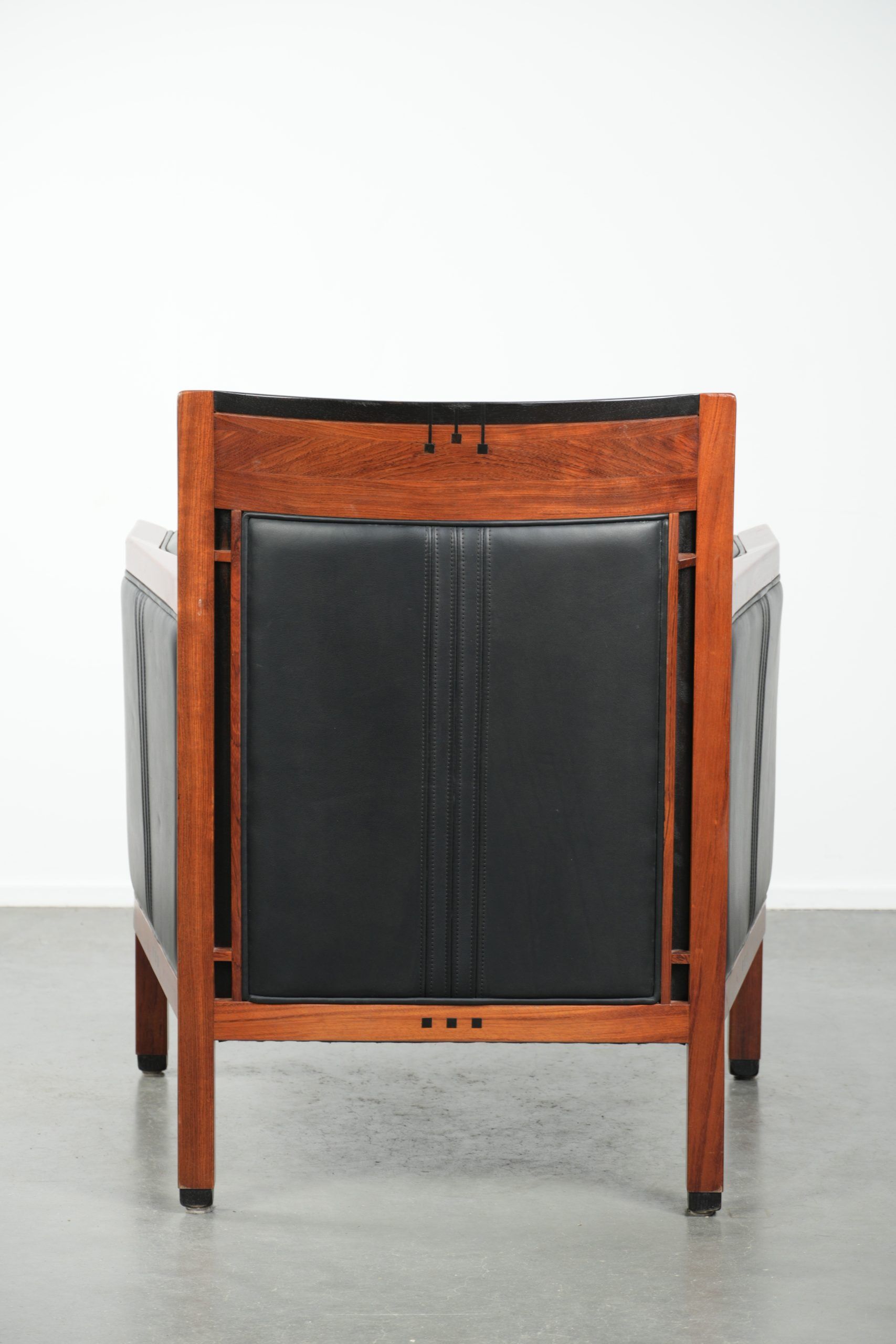 Black leather and wooden Art Deco design armchair