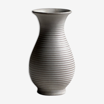 Small white striated vase with flared neck