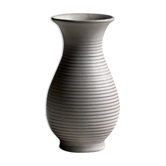 Small white striated vase with flared neck