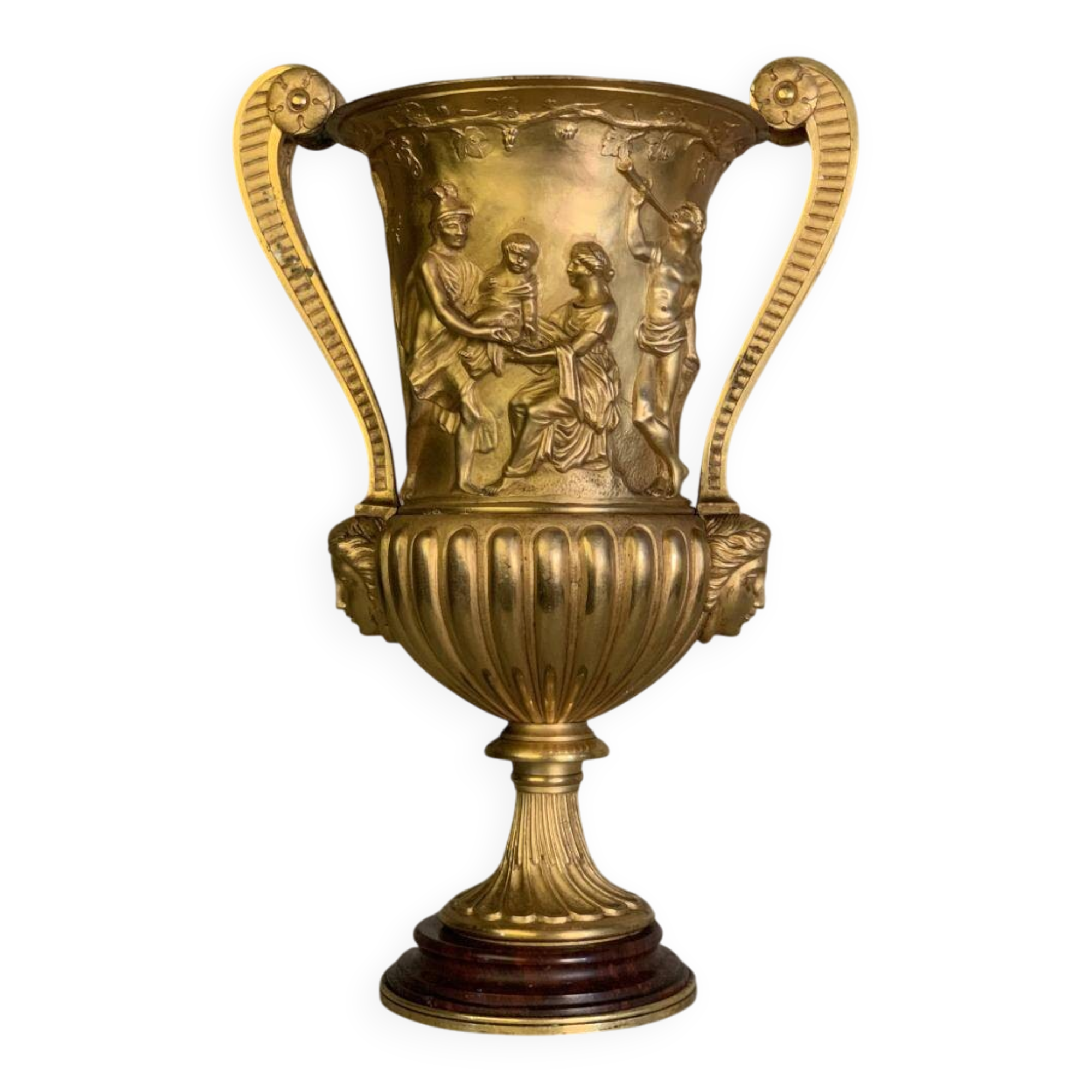 Golden bronze urn, base of red griotte marble.