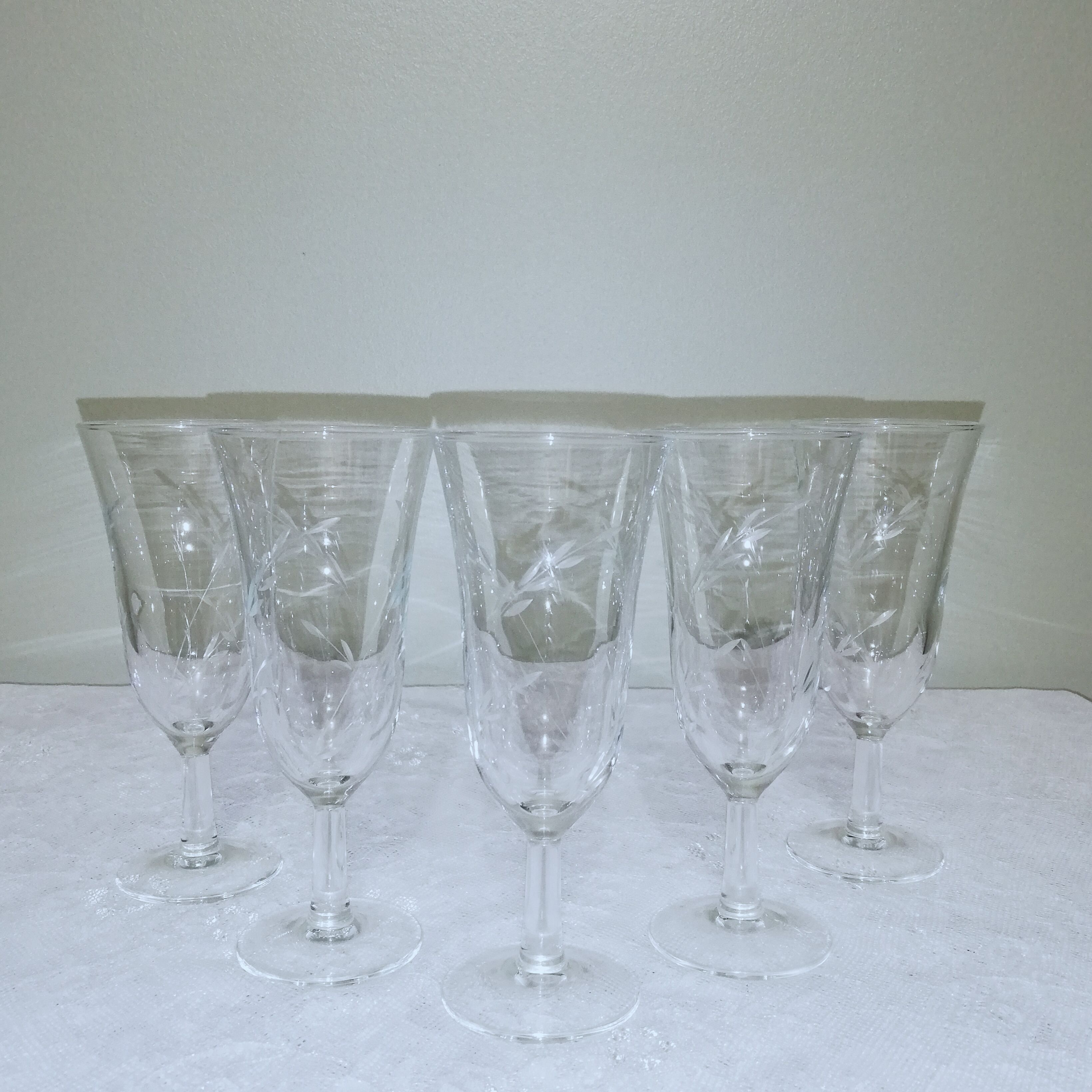 5 champagne flutes decorated with engraved ears