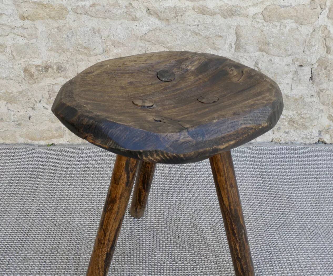 Tripod stool made of carved solid wood, handcrafted, around 1950.