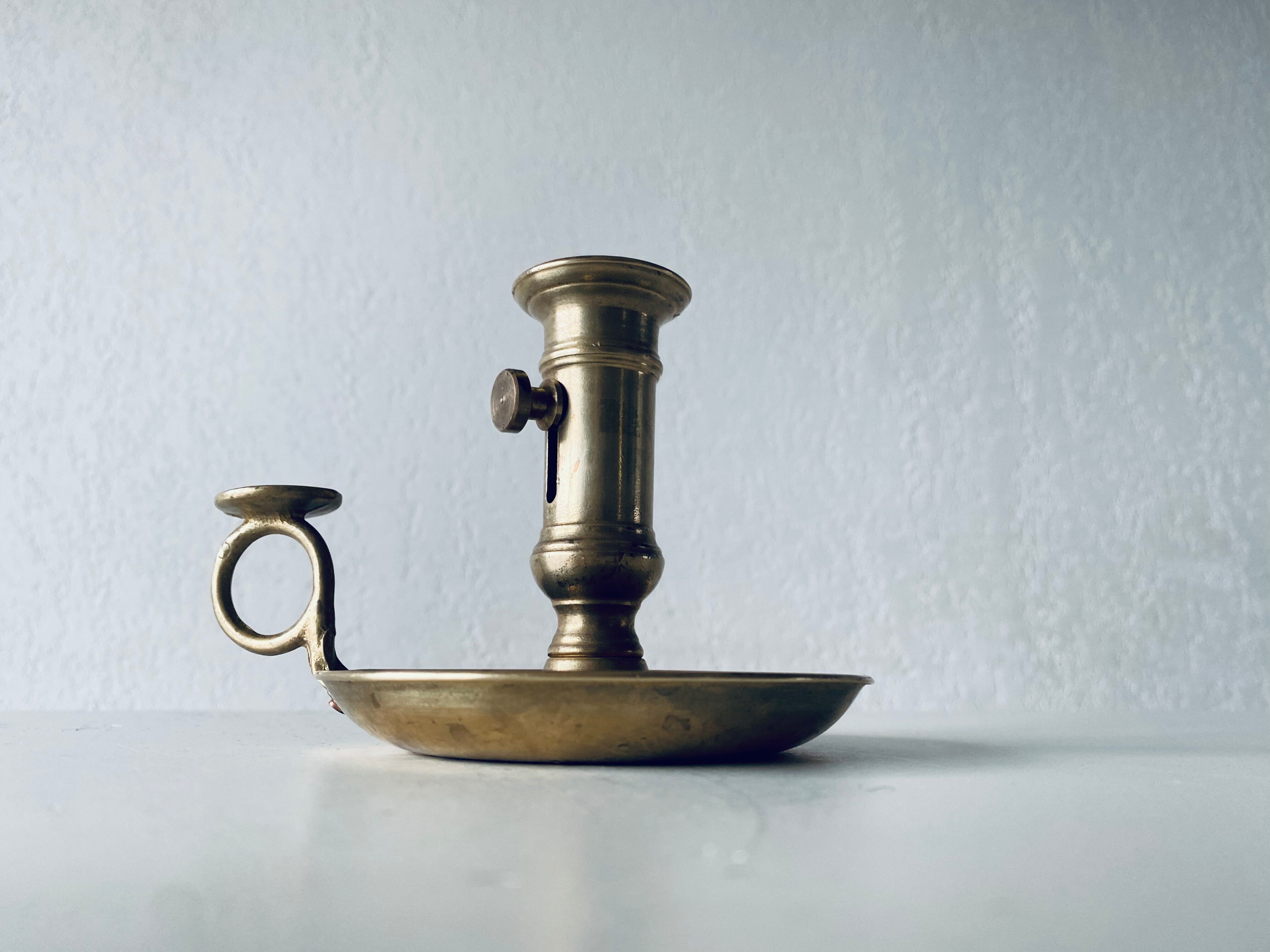 Antique brass candle holder