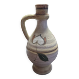 Handcrafted jug or jar with a handle, terracotta pottery vase, fat lava effect, stylized flowers