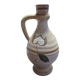 Handcrafted jug or jar with a handle, terracotta pottery vase, fat lava effect, stylized flowers