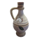 Handcrafted jug or jar with a handle, terracotta pottery vase, fat lava effect, stylized flowers