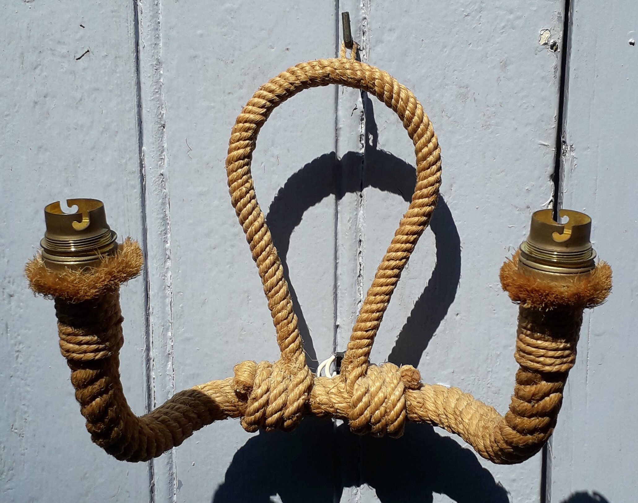 Handcrafted rope wall lamp
