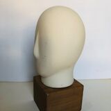 Ceramic head on wooden base