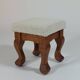 Unique sculpted stools, freshly upholstered and exquisite.
