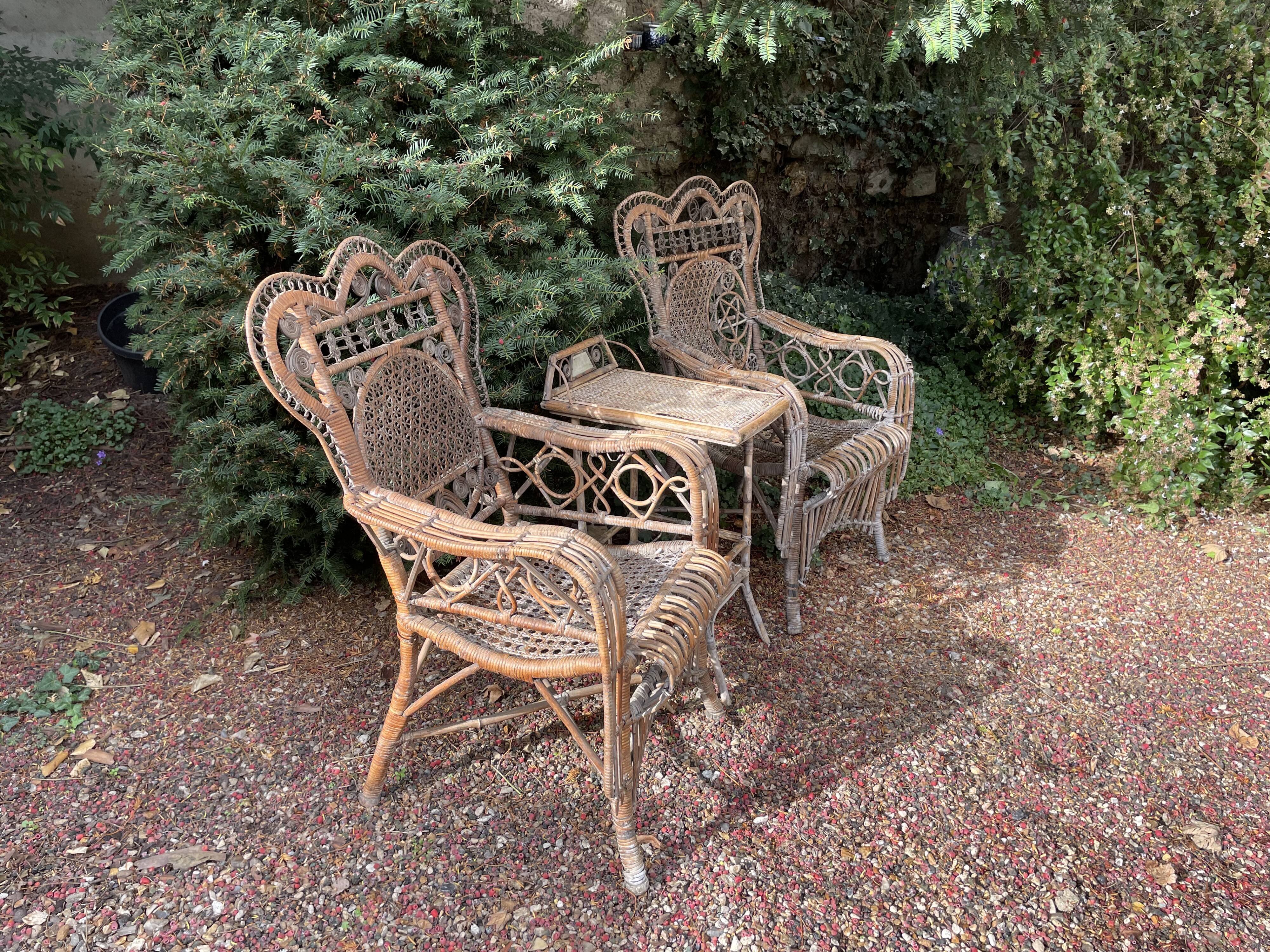 Paire de fauteuils anciens en rotin